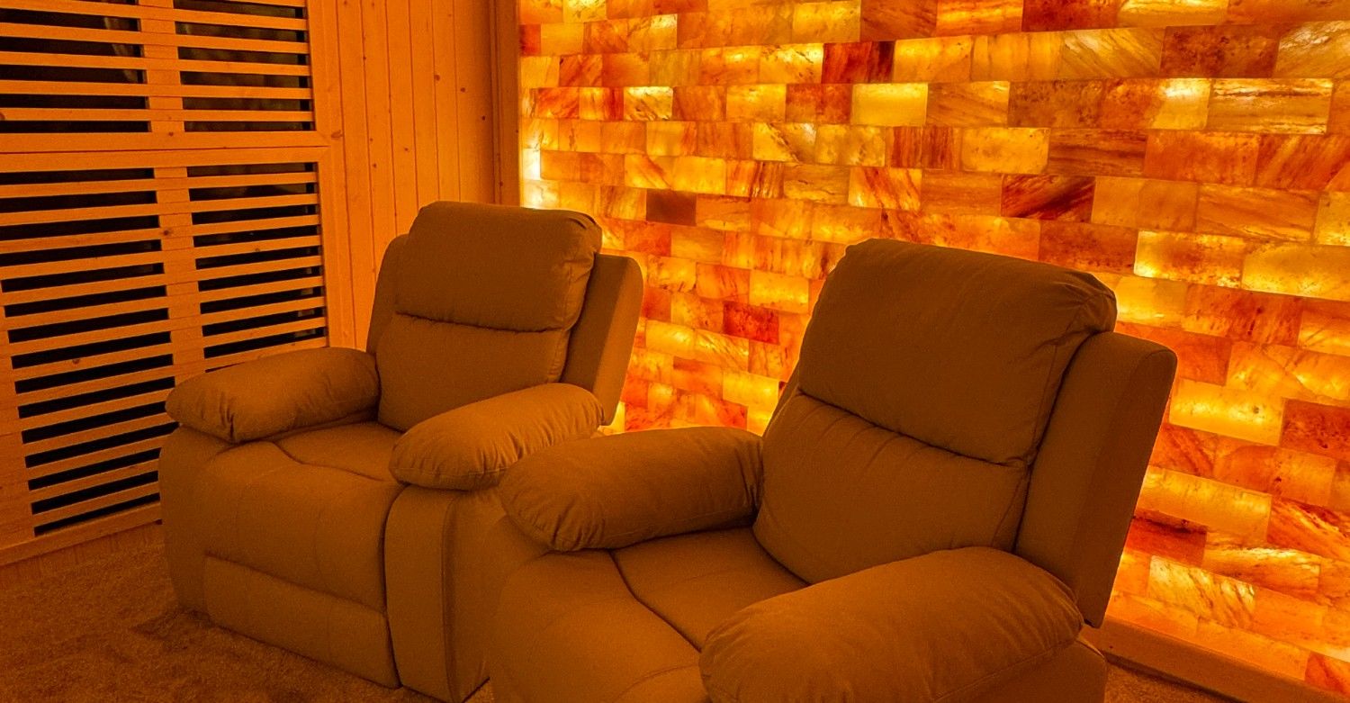 Clubhouse interior with modern seating and high ceilings.